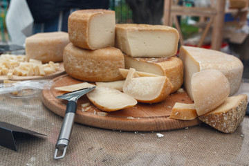 Freshly chopped cheese on the counter of the store. Food