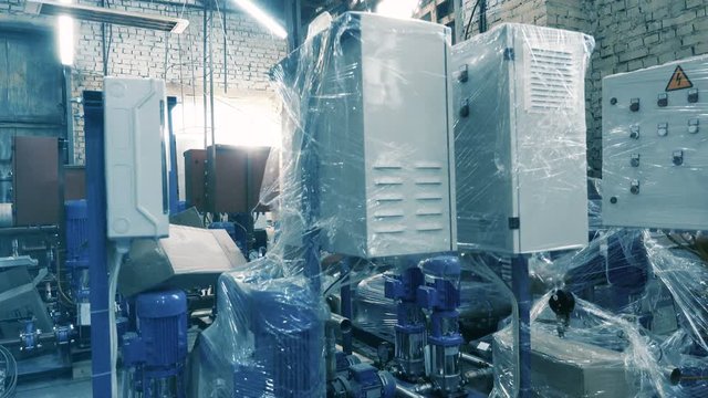 Rows of water pump control units at the factory