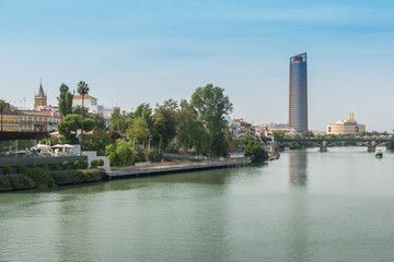 Naklejka premium Guadalquivir river Seville Tower Triana bridge Seville Spain