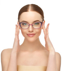 Woman in glasses. Fashion model in eyeglasses. Correction of vision. Advertising optics and eye products.