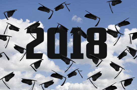 black graduation hats in sky for class of 2018