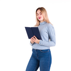 Young cute girl reads a book, isolated  