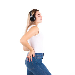Young cute girl listens music, isolated  
