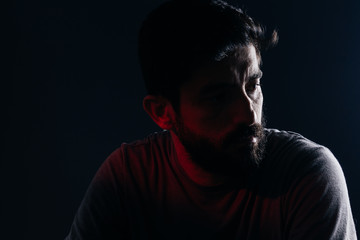 Dramatic portrait of bearded man. Concept of sadness, depression, alert