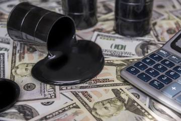 oil and barrels. poured oil on the money dollar currency. bargaining. Exchange. oil business. Profit growth rates, profit from sales of petroleum products.