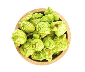 popcorn in wood bowl on white background
