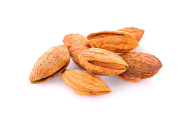 Heap of almond nuts isolated on white background