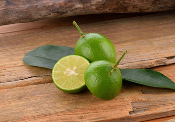 Fresh lime with on wooden background
