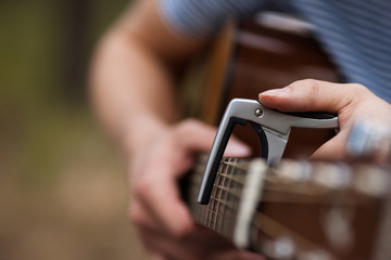 Musician lifestyle guitar concept. Stroller man at the nature. Artist instruments concept.