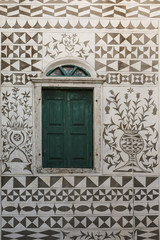 Traditionally decorated facade of a house in Pyrgi village on Chios island, Greece.
