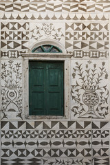 Traditionally decorated facade of a house in Pyrgi village on Chios island, Greece.
