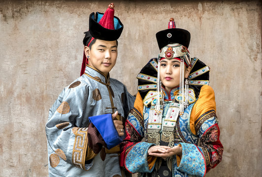 mongolian couple in traditional 13th century style outfits
