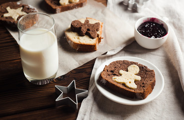 homemade breakfast - rustic style, milk, cupcake, jam on a wooden background