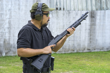 View of a man with a shotgun.