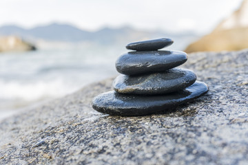 Fototapeta na wymiar Zen stones, background ocean for the perfect meditation