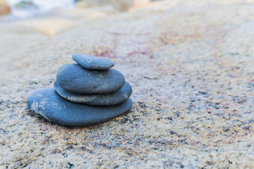 Fototapeta na wymiar Zen stones, background ocean for the perfect meditation