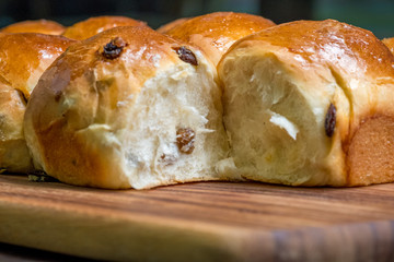Close up Homemade raisin bread on a wooden cutting board. (Selective focus)