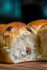 Close up Homemade raisin bread on a wooden cutting board. (Selective focus)