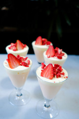Dessert strawberries and cream.   (selective focus)