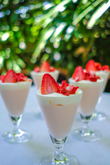 Dessert strawberries and cream.   (selective focus)