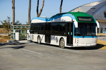 Electric bus stands at the charging station © scharfsinn86