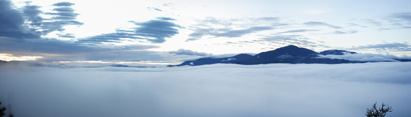 Fototapeta na wymiar Pano over the clouds.
