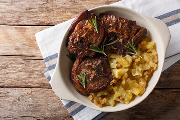 Indian food: lamb steak and spicy apple chutney close-up in a bowl. horizontal top view © FomaA