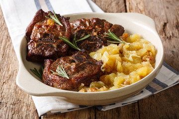 Indian cuisine: fried lamb steak and spicy apple sauce close-up in a bowl. horizontal © FomaA