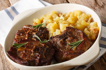 Indian food: lamb steak and spicy apple chutney close-up in a bowl. horizontal
