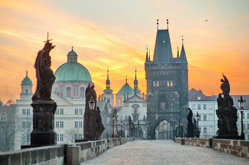 Fototapeta na wymiar Charles Bridge (Karluv Most) and Lesser Town Tower scenic view at sunrise, Prague, Czech Republic