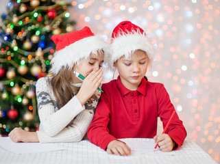 girl whispered to her brother what to ask for Santa Claus