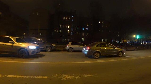 Night traffic on the road at night on Bolshaya Pushkarskaya Street on Petrograd Side in Saint-Petersburg, Russia.