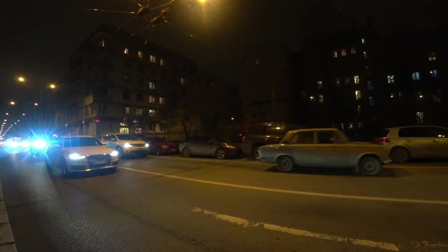     Night traffic on the road at night on Bolshaya Pushkarskaya Street on Petrograd Side in Saint-Petersburg, Russia. 
