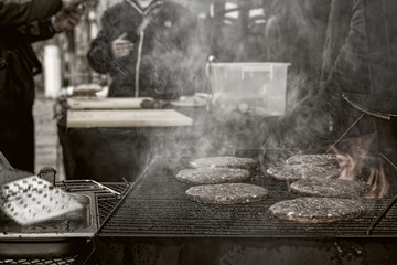 Cooking burgers on the street dark