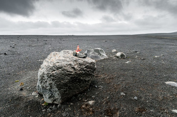 A little dwarf on a rock watching over travelers who venture on the F26 dirt road, Sprengisandur...