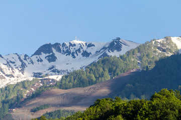 snow-capped mountain peaks against the blue sky