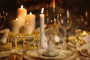 Dining table with lighted candles