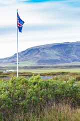 icelandic flag near Kerid Lake in Iceland