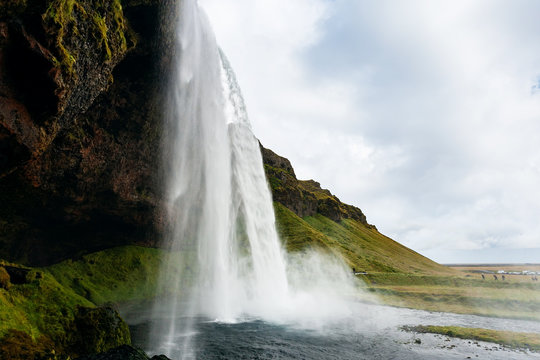cave and Seljalandsfoss waterfall in Iceland