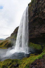 side view of Seljalandsfoss waterfall in Iceland