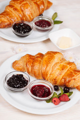 Tasty croissants lying on the plate