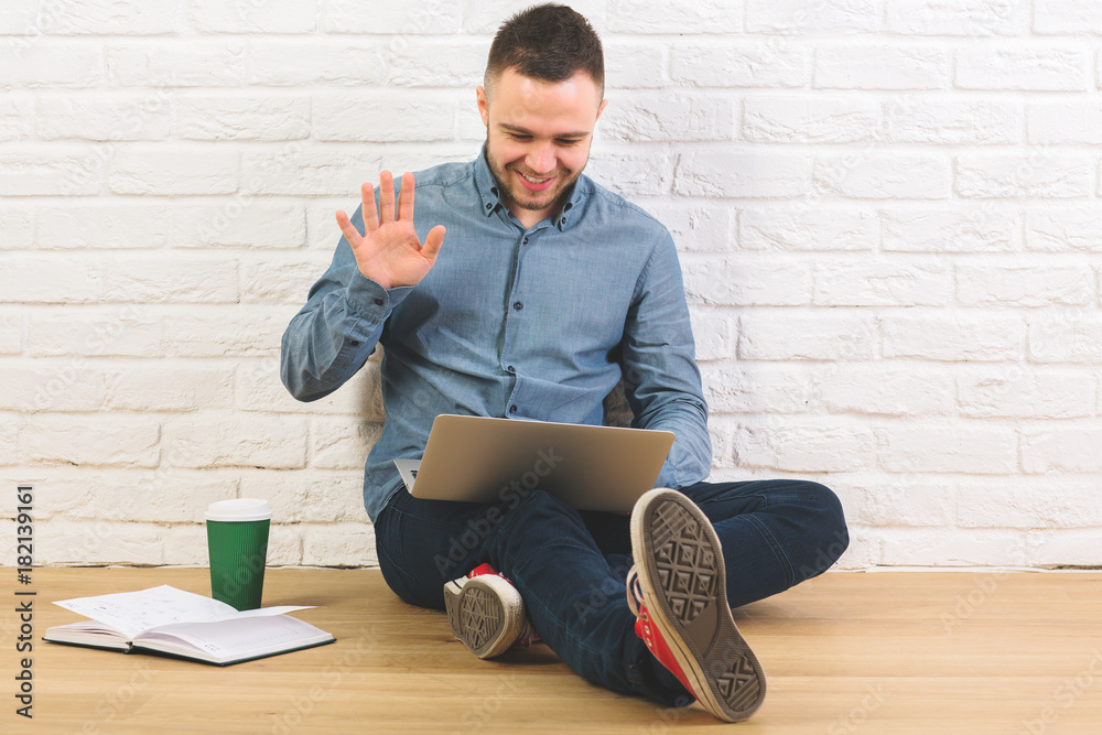 Poster Attractive man with laptop and coffee