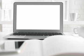 Fototapeta premium Office desk top with empty laptop screen