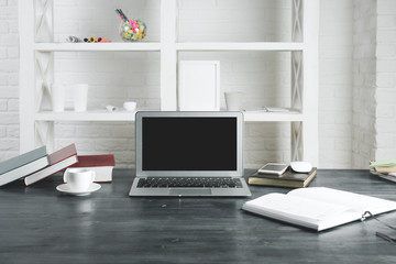 Modern office desktop with empty laptop screen