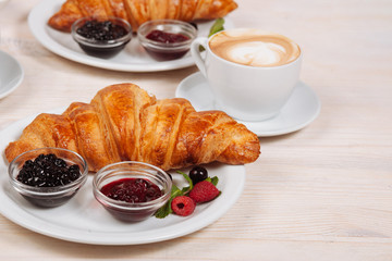 Close up of fresh croissants with coffee