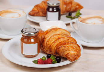 Close up of fresh croissants served with home made preserves