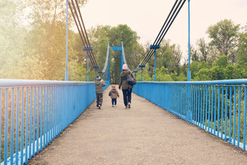 Walking family on the bridge 