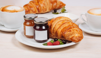 Home made preserved served with croissants