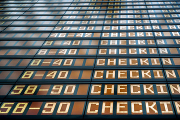 Closeup departures board in airport