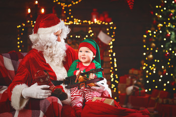 Fototapeta na wymiar Santa Claus and little elf for Christmas